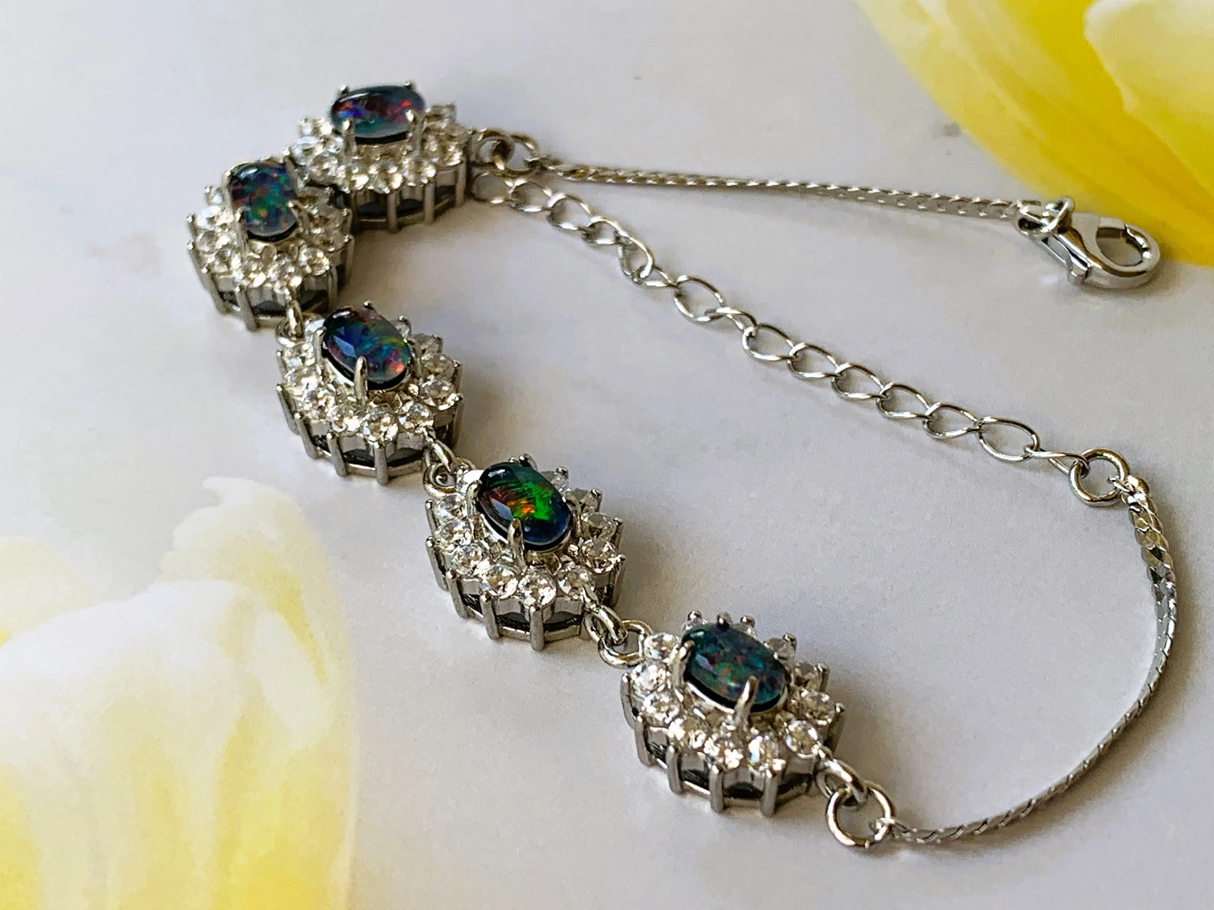 Australian Triplet Opals surrounded by cubic zirconia bracelet set in Sterling Silver